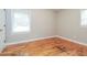 Bedroom with hardwood floors and plenty of natural light from the windows at 101 Longstreet Cir, Oxford, GA 30054