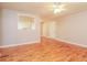 Open living room with hardwood floors and views into the kitchen at 101 Longstreet Cir, Oxford, GA 30054