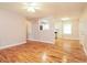 Spacious living room with hardwood floors and access to the kitchen area at 101 Longstreet Cir, Oxford, GA 30054