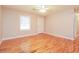 Bright living room featuring hardwood floors and a ceiling fan at 101 Longstreet Cir, Oxford, GA 30054
