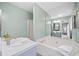 Bright bathroom with a soaking tub and shower showcasing modern fixtures and finishes at 173 Cline Smith Ne Rd, Cartersville, GA 30121