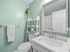 Bright bathroom with a toilet, a sink, and a towel rack, offering functionality and convenience in a compact space at 173 Cline Smith Ne Rd, Cartersville, GA 30121