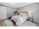 Bedroom with neutral walls, stylish floor, and a comfortable bed with bright white bedding at 173 Cline Smith Ne Rd, Cartersville, GA 30121