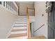 Welcoming entryway features staircase with white risers and wooden railings at 173 Cline Smith Ne Rd, Cartersville, GA 30121