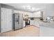 Functional kitchen equipped with stainless steel appliances, white cabinets, and tile flooring at 173 Cline Smith Ne Rd, Cartersville, GA 30121