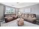 Comfortable living room with reclining sofas, a coffee table, and a window, perfect for relaxation and entertainment at 173 Cline Smith Ne Rd, Cartersville, GA 30121