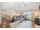 Bright living room featuring a vaulted ceiling, hardwood floors, and a comfortable gray sectional sofa at 173 Cline Smith Ne Rd, Cartersville, GA 30121