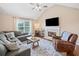 Cozy living room featuring a fireplace, vaulted ceiling, and ample seating at 173 Cline Smith Ne Rd, Cartersville, GA 30121