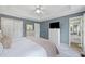 Relaxing main bedroom with ensuite bathroom access, a tray ceiling, and a spacious layout at 173 Cline Smith Ne Rd, Cartersville, GA 30121