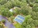 Aerial view of community pool, tennis courts, and lush green landscaping at 2056 Plantation Rd, Lawrenceville, GA 30044