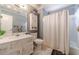 Bathroom with white marble floor, shower-tub, and white vanity at 2056 Plantation Rd, Lawrenceville, GA 30044