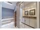 Beautiful bathroom with double vanity and separate tub at 2056 Plantation Rd, Lawrenceville, GA 30044