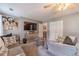 Comfortable bedroom with seating area, ceiling fan, and neutral palette offers relaxation and functionality at 2056 Plantation Rd, Lawrenceville, GA 30044