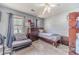 Cozy bedroom with soft carpet and natural light from two windows at 2056 Plantation Rd, Lawrenceville, GA 30044