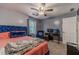 Bedroom with desk, gray walls, blue chair and modern decor at 2056 Plantation Rd, Lawrenceville, GA 30044