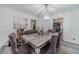 Elegant dining room with modern chandelier, stylish decor, and ample seating for dinner parties at 2056 Plantation Rd, Lawrenceville, GA 30044