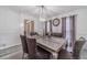 Bright dining room with chic chandelier, seating for six, and views of the entryway, ideal for entertaining at 2056 Plantation Rd, Lawrenceville, GA 30044