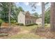 Well-maintained brick home featuring black shutters and a lush, green yard at 2056 Plantation Rd, Lawrenceville, GA 30044