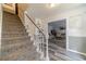 Welcoming foyer featuring hardwood floors, a staircase, and views into a cozy living area, perfect for guests at 2056 Plantation Rd, Lawrenceville, GA 30044