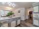 Spacious kitchen features a gray island with a white marble top, gray cabinets, and stainless steel appliances at 2056 Plantation Rd, Lawrenceville, GA 30044