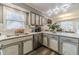 Bright kitchen with stainless steel appliances, marble countertops, and a view into the dining area, perfect for entertaining at 2056 Plantation Rd, Lawrenceville, GA 30044