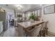 Modern kitchen boasts a marble countertop island with seating and updated stainless steel appliances at 2056 Plantation Rd, Lawrenceville, GA 30044