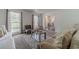 Bright living room features modern decor, neutral tones, and natural light from large windows, creating an inviting space at 2056 Plantation Rd, Lawrenceville, GA 30044