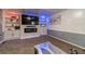 Stylish living room with custom built-ins, a large screen TV, and decorative lighting at 2056 Plantation Rd, Lawrenceville, GA 30044