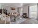 Inviting living room featuring neutral tones, large windows, and a comfortable seating arrangement at 2056 Plantation Rd, Lawrenceville, GA 30044