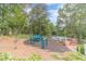 Well-maintained playground in a park-like setting with lush trees and landscaping at 2056 Plantation Rd, Lawrenceville, GA 30044