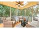 Relaxing screened porch with ceiling fan and comfortable wicker furniture at 2056 Plantation Rd, Lawrenceville, GA 30044