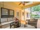 Screened porch with stylish furniture, ceiling fan, and natural light at 2056 Plantation Rd, Lawrenceville, GA 30044