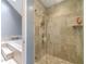 Modern tiled shower with glass door next to soaking tub at 2056 Plantation Rd, Lawrenceville, GA 30044