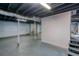 An unfinished basement with concrete floors and exposed ceiling at 2279 Hickory Grove Nw Rd, Acworth, GA 30101