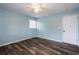 A bright bedroom featuring a ceiling fan, window, and modern flooring at 2279 Hickory Grove Nw Rd, Acworth, GA 30101