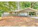 Single-story home featuring a covered carport and manicured landscaping at 2279 Hickory Grove Nw Rd, Acworth, GA 30101