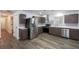 Bright kitchen featuring modern appliances, stone countertops and sleek cabinets at 2279 Hickory Grove Nw Rd, Acworth, GA 30101
