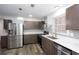 Modern kitchen with stainless steel appliances, grey cabinets, and a stylish backsplash at 2279 Hickory Grove Nw Rd, Acworth, GA 30101