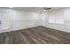 Bright, open living room with elegant wall paneling and contemporary flooring at 2279 Hickory Grove Nw Rd, Acworth, GA 30101