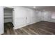 Open living space featuring access to storage, and modern flooring at 2279 Hickory Grove Nw Rd, Acworth, GA 30101