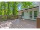 Expansive wooden deck featuring a railing and access to the yard, ideal for outdoor dining and relaxation at 630 Pennylake Ct, Stone Mountain, GA 30087