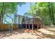 Spacious backyard with a wooden deck, offering a perfect space for outdoor entertaining and relaxation at 630 Pennylake Ct, Stone Mountain, GA 30087