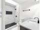 Modern bathroom featuring a beautifully tiled walk-in shower and sleek vanity with white countertop at 630 Pennylake Ct, Stone Mountain, GA 30087