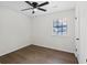 This bedroom features a ceiling fan and a window offering natural light at 630 Pennylake Ct, Stone Mountain, GA 30087