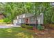 Beautiful two-story home with a covered porch, red door, and well-manicured landscaping, creating a welcoming curb appeal at 630 Pennylake Ct, Stone Mountain, GA 30087