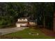 Charming two-story home with a well-maintained lawn, a covered porch, and a paved driveway at 630 Pennylake Ct, Stone Mountain, GA 30087