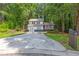 Inviting two-story home boasts a large driveway and a covered front porch, perfect for enjoying the outdoors at 630 Pennylake Ct, Stone Mountain, GA 30087