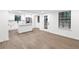 Open-concept kitchen with white cabinets and stainless steel appliances at 630 Pennylake Ct, Stone Mountain, GA 30087