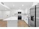Modern kitchen featuring quartz countertops and stainless steel appliances at 630 Pennylake Ct, Stone Mountain, GA 30087