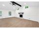 Bright living room with modern fireplace and beautiful hardwood floors at 630 Pennylake Ct, Stone Mountain, GA 30087